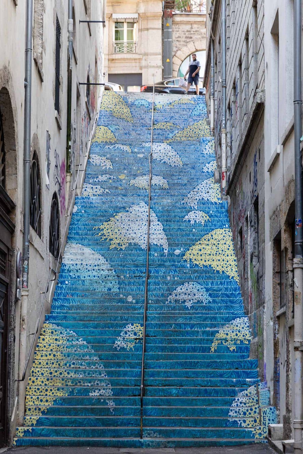 Vertical photo of decorated steps on the Croix Rousse part of Lyon.