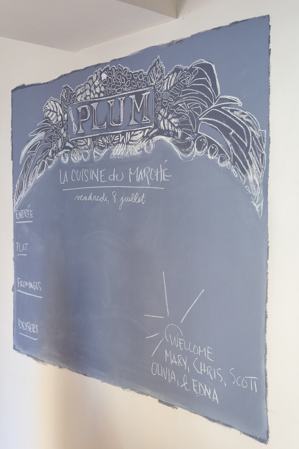 Vertical photo of the Plum Lyon cooking class menu board.