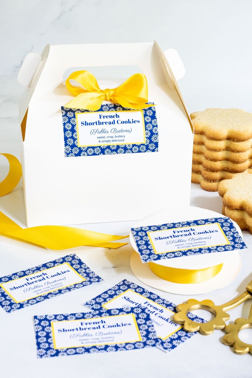 Vertical photo of gift boxes and custom gift labels for French Shortbread Cookies (Sablés Bretons).