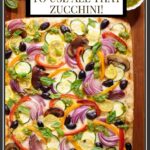 Vertical overhead photo of a Ridiculously Easy Roasted Veggie Sheet Pan Pizza on a wood cutting board.