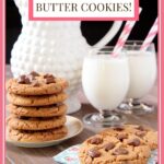 Vertical photo of a batch of One-Bowl Reese's Peanut Butter Cup Cookies with a pitcher and glasses of milk in the background.