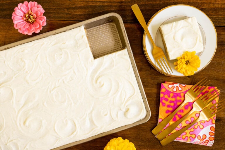 Horizontal overhead photo of a Ridiculously Easy Butterscotch Sheet Cake with a slice on an individual serving plate.