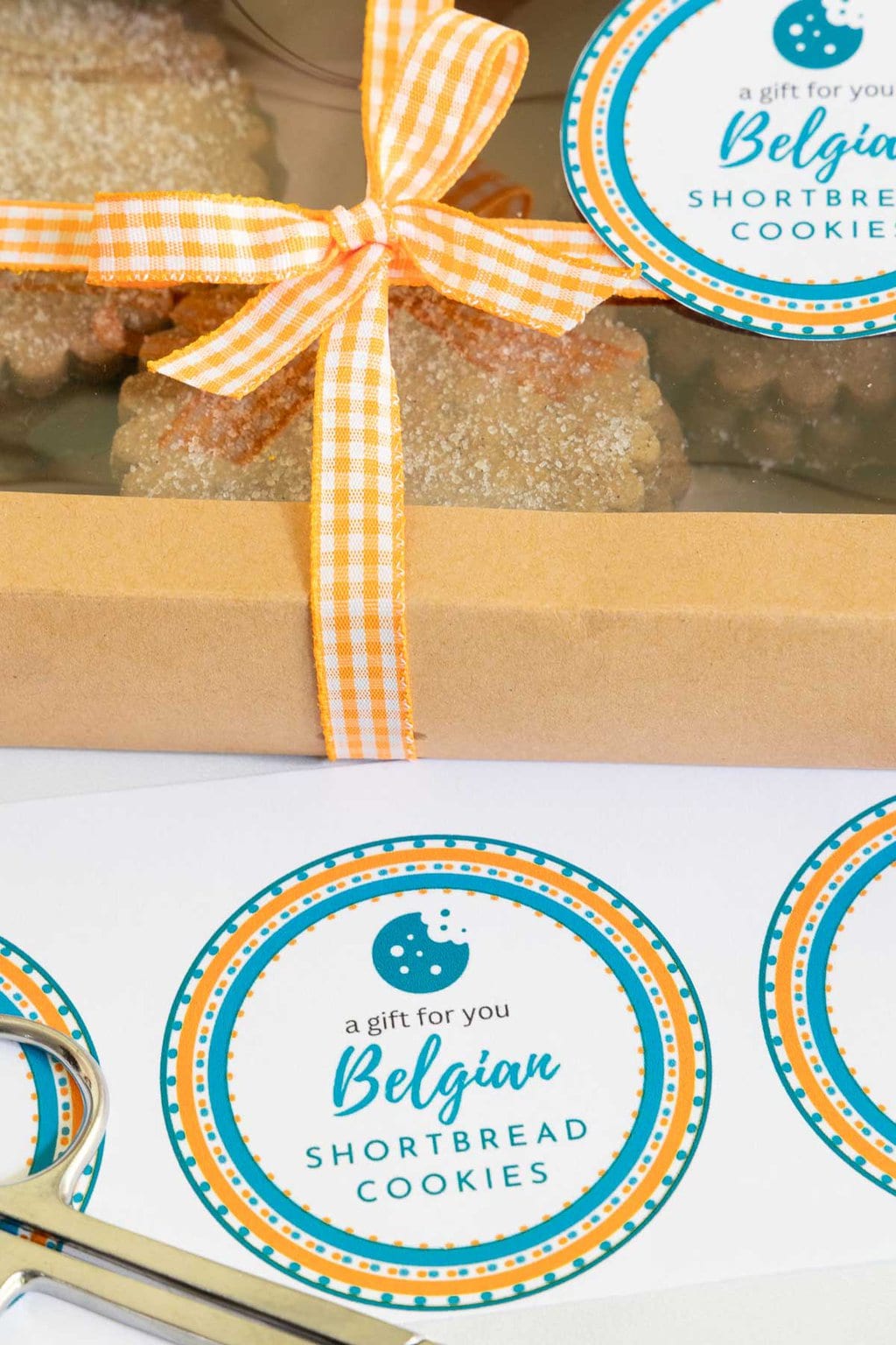 Vertical closeup photo of Belgian Shortbread Cookie custom labels for gift giving.