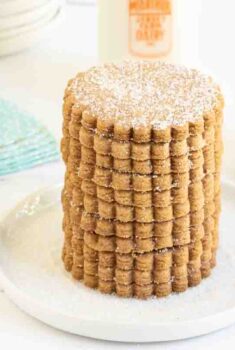 Horizontal photo of a stack of Belgian Shortbread Cookies on a white serving plate.