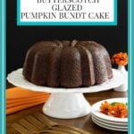 Vertical photo of a Butterscotch Glazed Pumpkin Bundt Cake with orange napkins and flowers and a rectangular text title box at the top of the photo.
