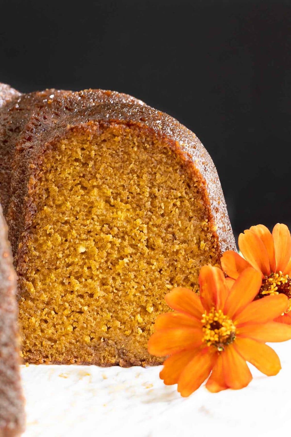 Vertical closeup photo of the inside crumb of a Ridiculously Easy Butterscotch Glazed Pumpkin Bundt Cake.