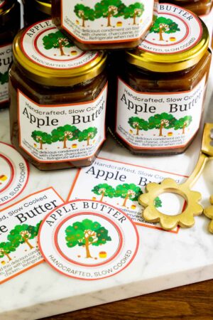 two hexagonal jars on Apple Butter with gold lids and a custom label