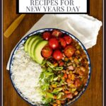 Vertical overhead photo of a serving bowl of Healthy Hoppin' John with rice, sliced avocados, tomatoes and onions.