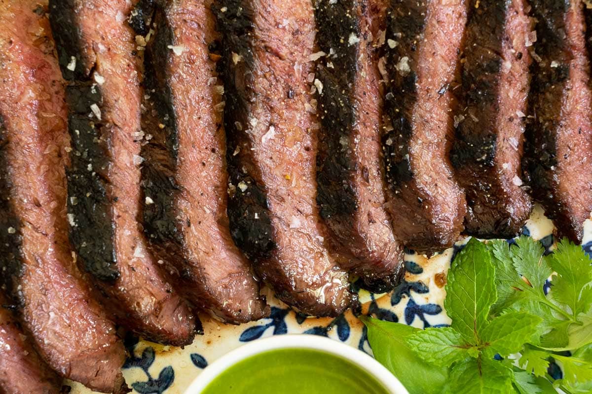 Horizontal overhead closeup photo of slices of Vietnamese Grilled Flat Iron Steak.