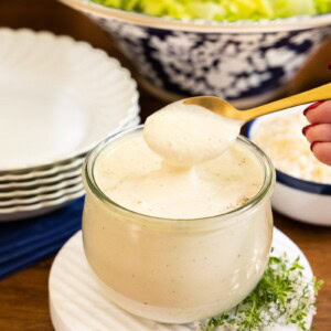 Horizontal photo of a Weck jar filled with Ridiculously Easy Caesar Dressing.