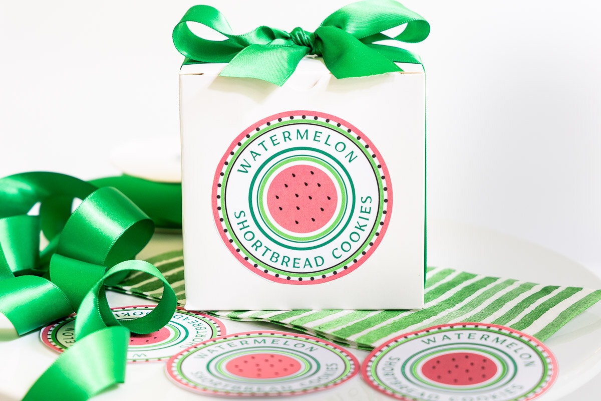 Horizontal closeup photo of Watermelon Shortbread Cookie labels on a gift box.
