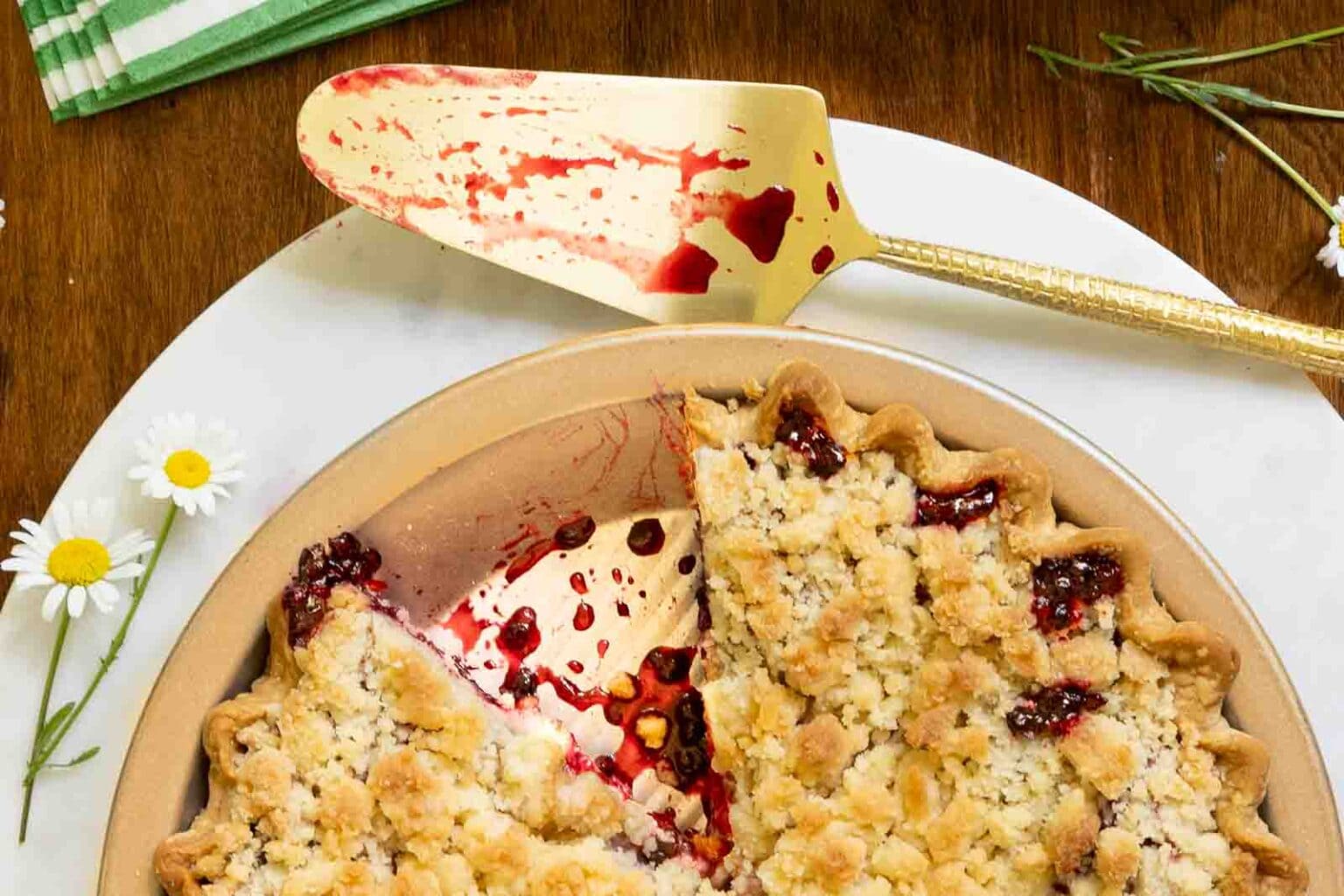 Easy Blackberry Crumble Pie - thecafesucrefarine.com Horizontal overhead closeup photo of a Easy Blackberry Crumble Pie on a marble surface resting on a wood table.