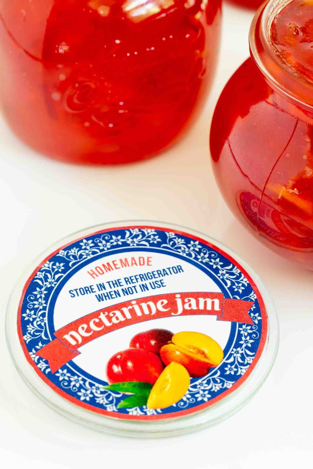 Vertical closeup photo of a custom label for Fresh Nectarine Jam suitable for gift giving.