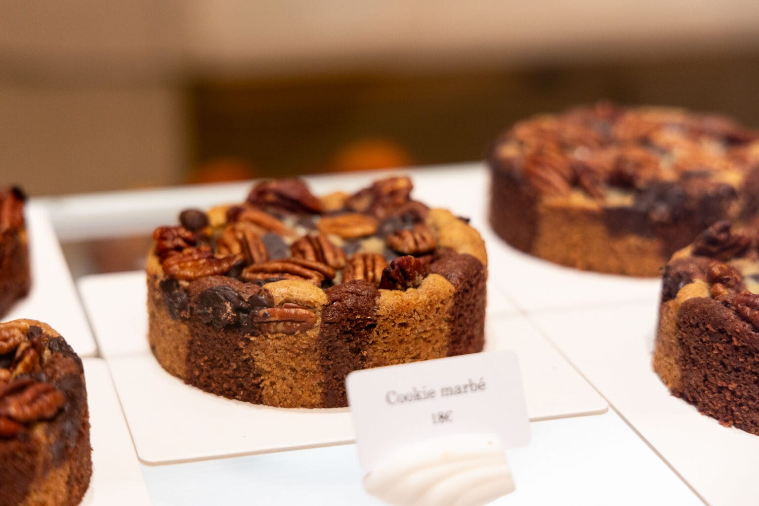 Horizontal closeup photo of a Cookie Marblé at Le Comptoir patisserie at The Ritz Hotel in Paris, France.