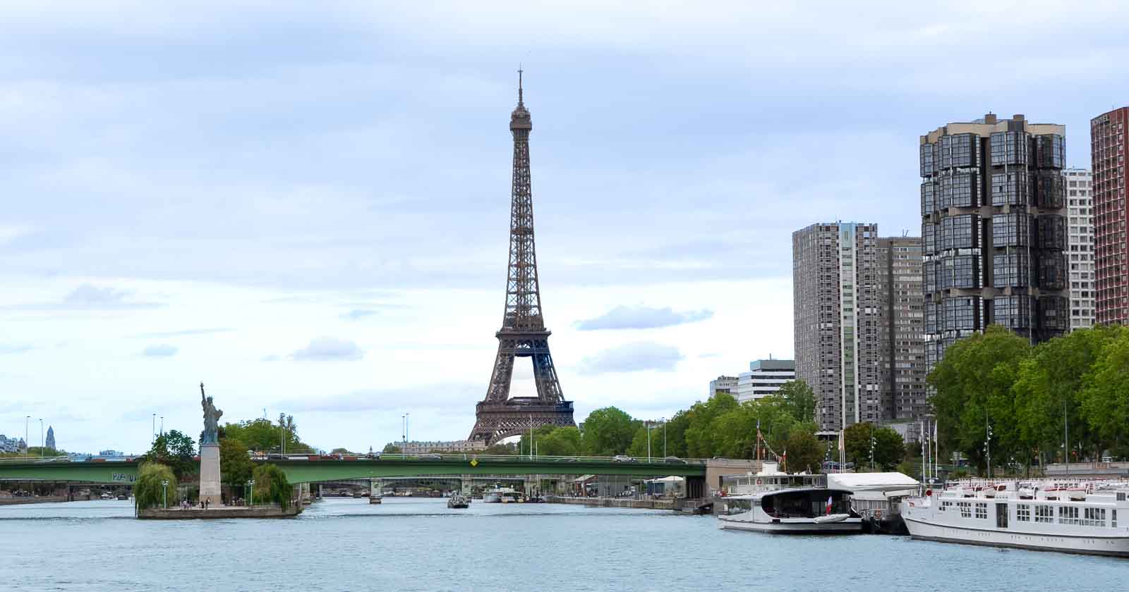 Horizontal photo of the Eiffel Tour in downtown Paris France from the Seine River.