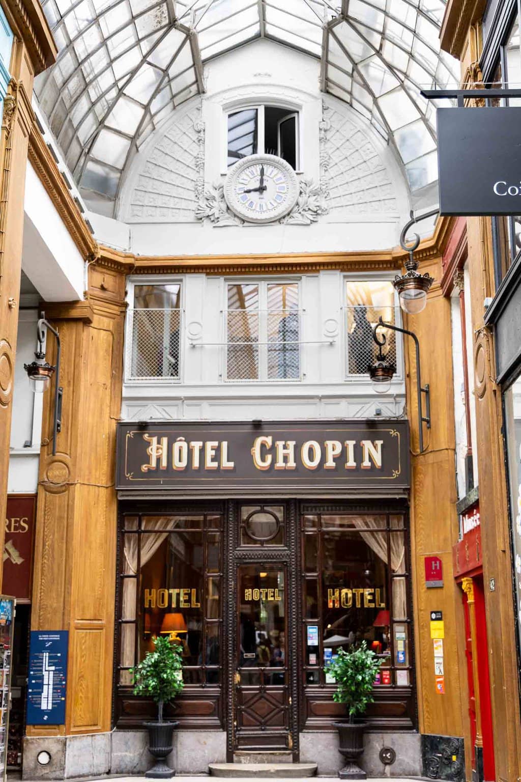 Vertical photo of Hotel Chopin in one of Paris' gallery shopping/dining/hotel areas.