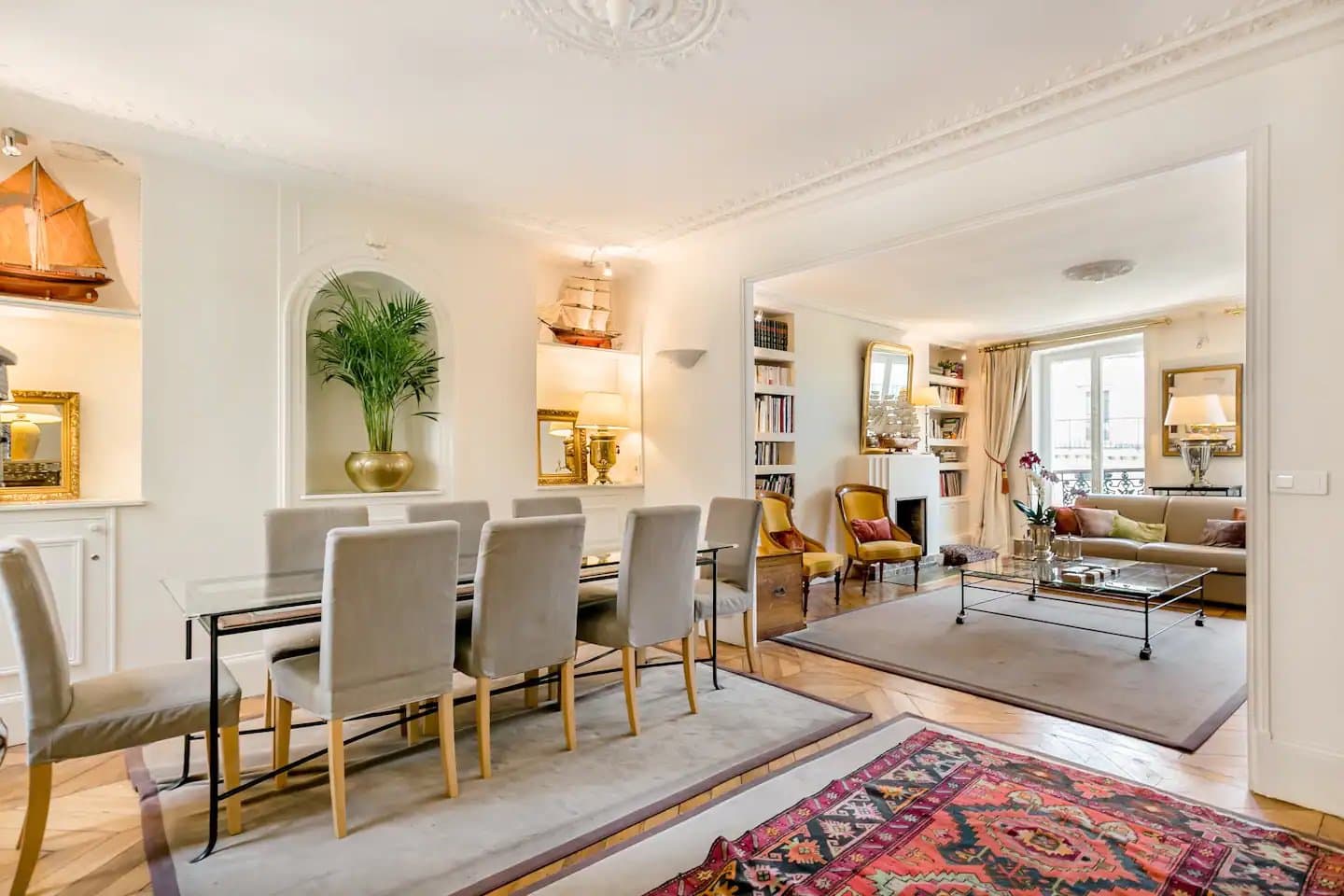 Horizontal photo of the dining and living room in Renee's Air BnB apartment in Paris.