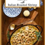 Vertical overhead photo of a iron skillet of Butternut Squash Risotto with Italian Roasted Shrimp on a round wood hot plate.