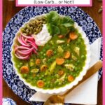 Vertical overhead photo of a bowl of Peruvian Chicken and Rice Soup in a white serving bowl garnished with pepitas, pickled red onions, yogurt and fresh cilantro leaves.