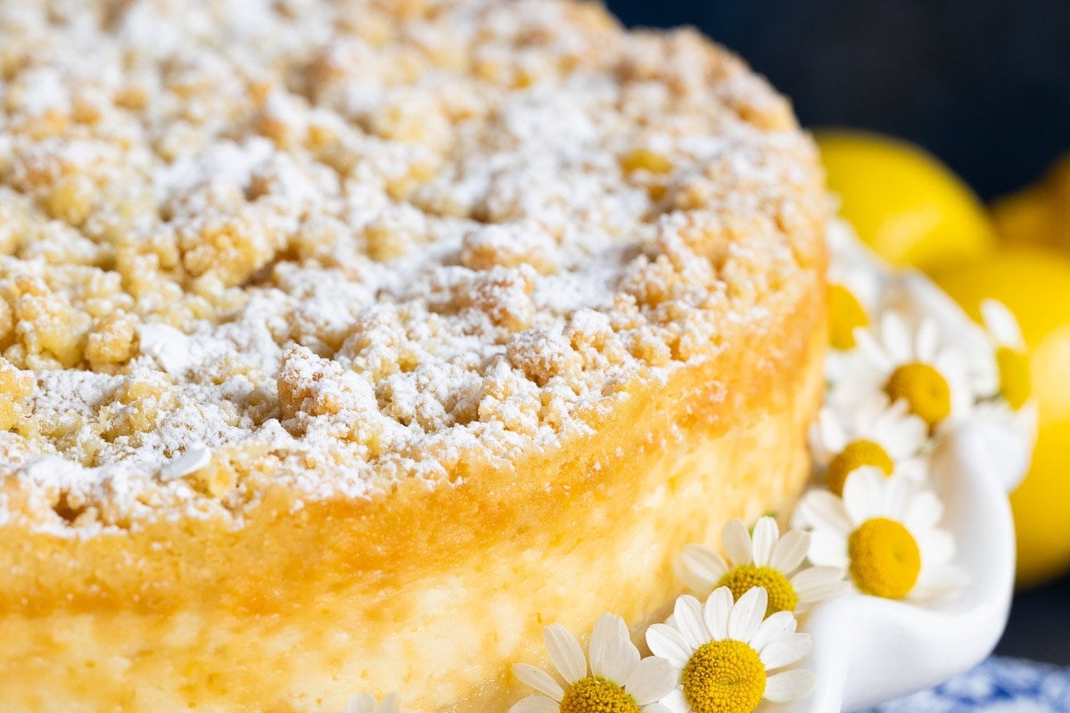 Horizontal extreme closeup photo of the side and top of an Italian Lemon Curd Ricotta Tart.