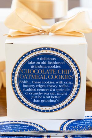a box of Chocolate Chip Oatmeal Cookies tied with a bow and labeled with a custom label