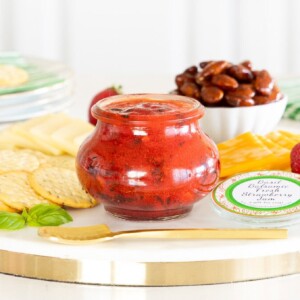 Horizontal photo of an appetizer tray featuring Basil Balsamic Strawberry Freezer Jam.