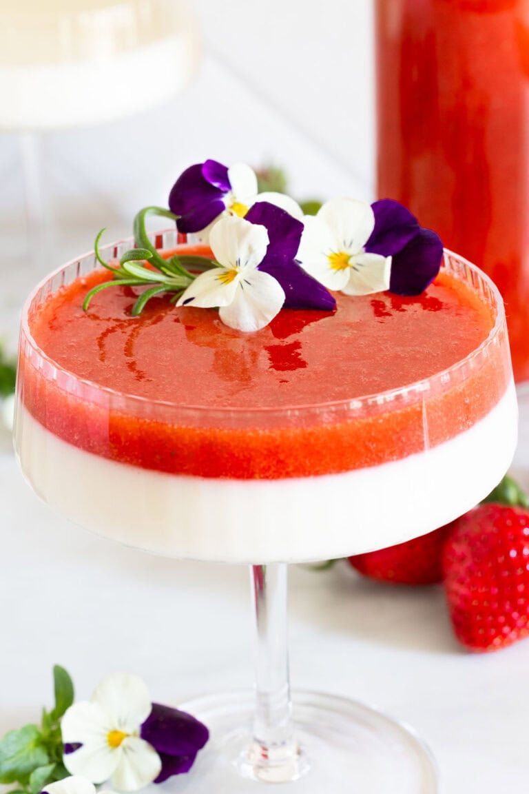 Vanilla Bean Panna Cotta with strawberry coulis on top