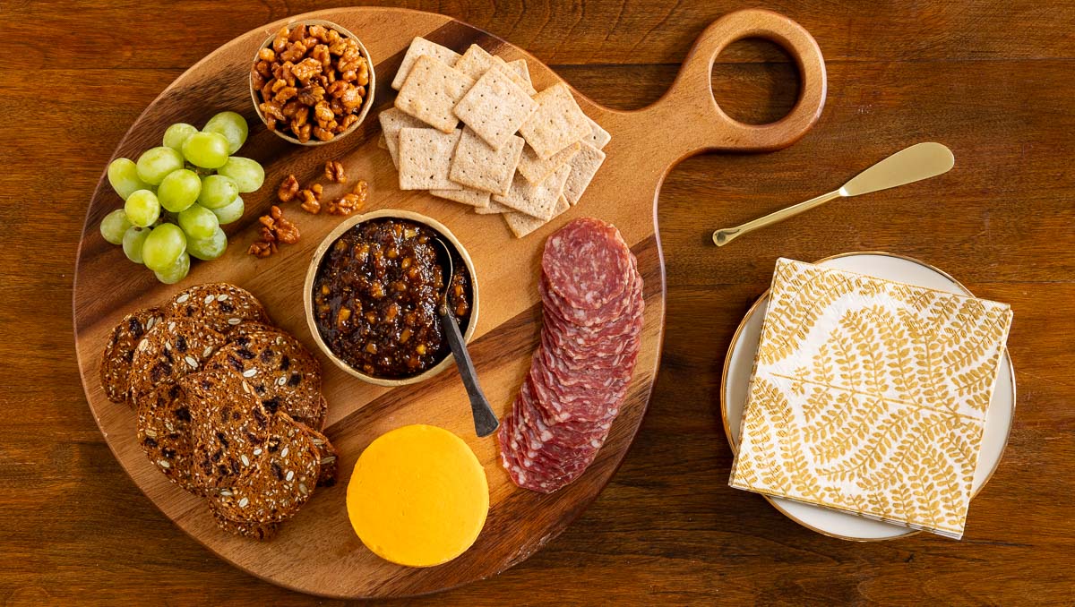Caramelized Fig Jam with Honey and Pears - thecafesucrefarine.com Overhead horizontal photo of a charcuterie board featuring Caramelized Fig Jam with Honey and Pears.