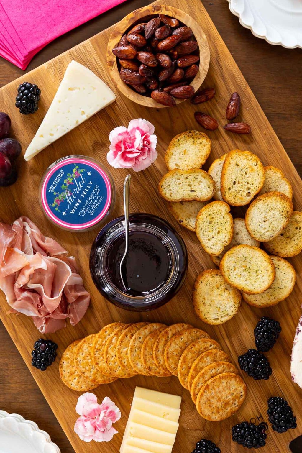 Ridiculously Easy Merlot Wine Jelly - thecafesucrefarine.com Vertical overhead photo of a charcuterie board featuring Ridiculously Easy Merlot Wine Jelly.