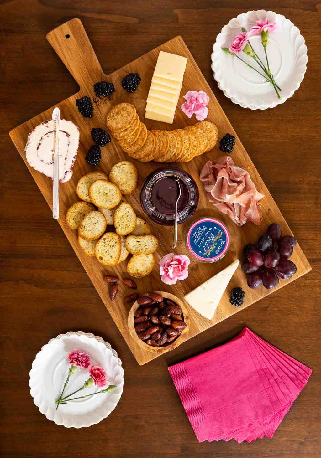 Ridiculously Easy Merlot Wine Jelly - thecafesucrefarine.com Vertical overhead photo of a wood appetizer tray featuring Ridiculously Easy Merlot Wine Jelly.
