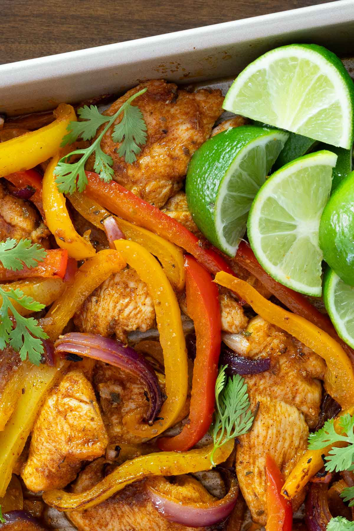 Overhead closeup photo of the ingredients for making Sheet Pan Chicken Fajitas.