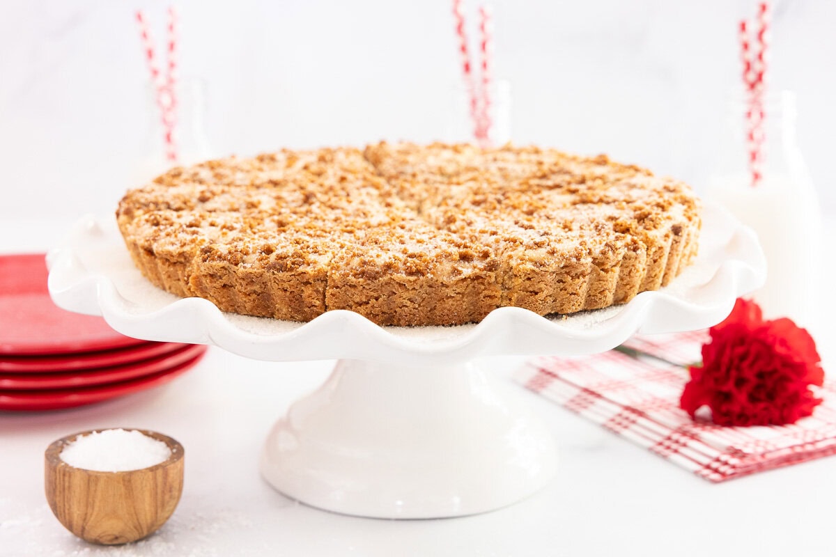 https://thecafesucrefarine.com/biscoff-shortbread/ on a scalloped white cake stand with red accents all around