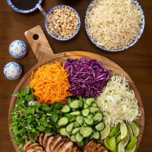 This colorful lemongrass grilled chicken bowl setup is perfect for a make-your-own dinner! Packed with vibrant veggies, rice noodles, herbs, and bold Vietnamese flavors. A fun and healthy way to feed a crowd or prep lunches for the week!