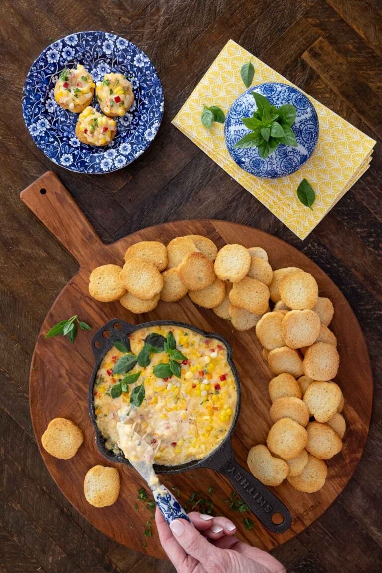 Korean Corn Cheese Dip in a small cast iron skillet with crostini.