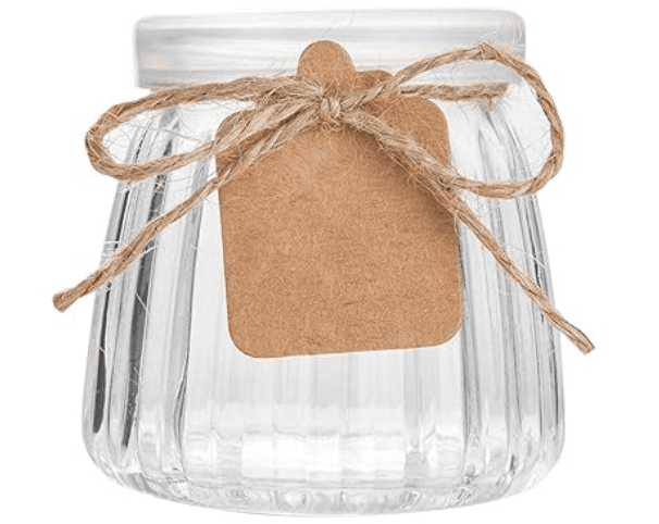 Flutted jar with a clear plastic top and brown paper label held on with twine.