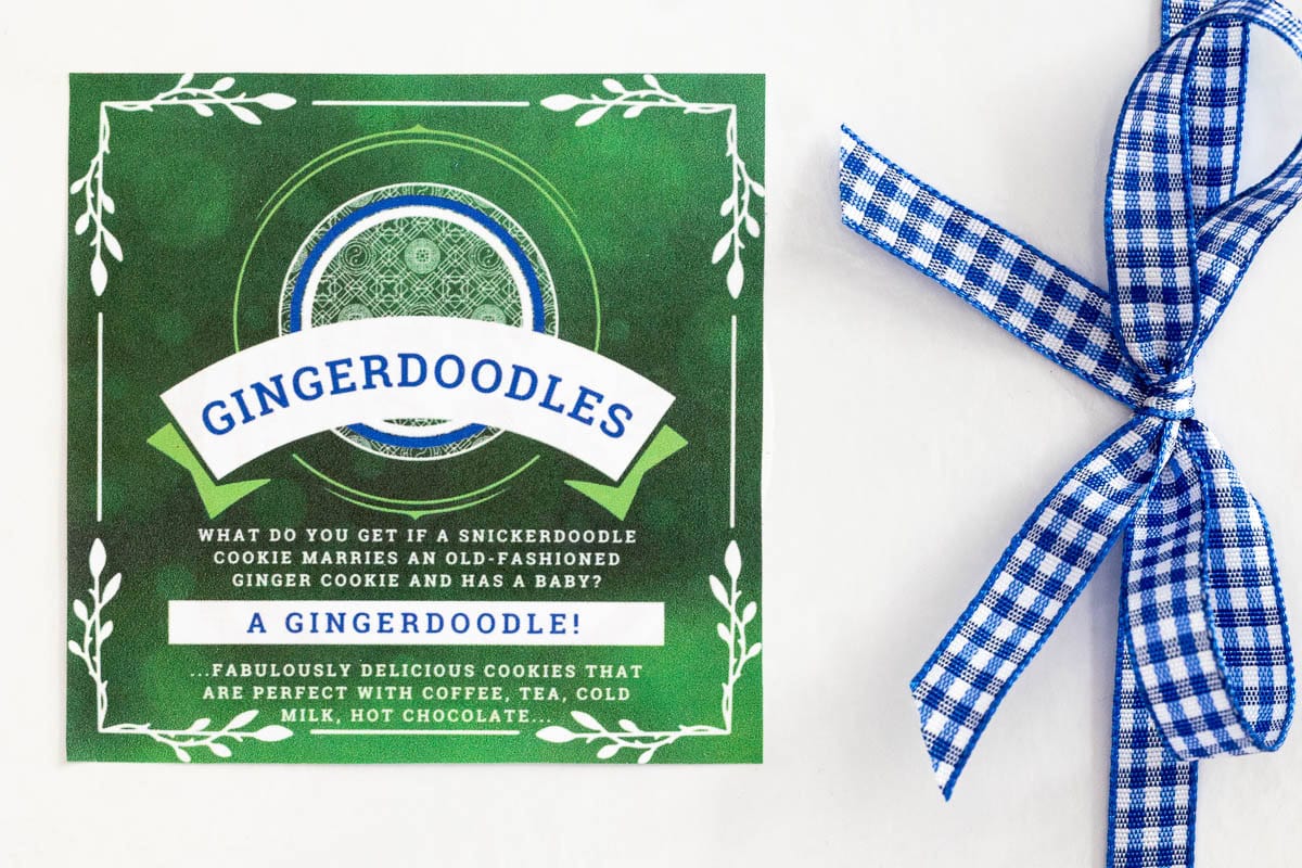 Close-up of a Gingerdoodle Cookie gift label on a white box tied with blue gingham ribbon.
