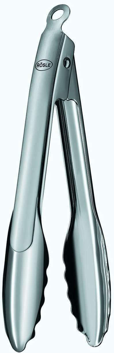 a pair of silver tongs for serving food