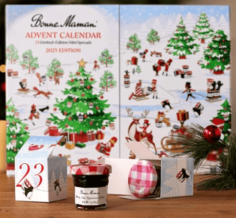 Bonne Maman Advent Calendar sitting on a wood surface with a small jar of jam sitting in the foreground