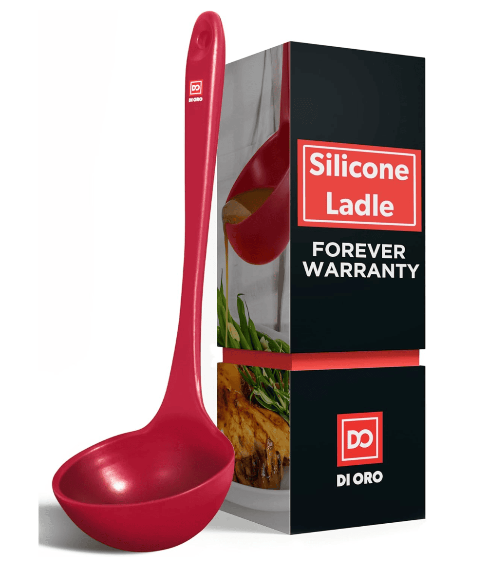 a red ladle leaning against a black, red and white box