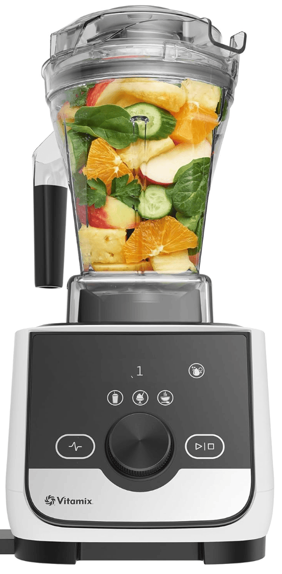 a black and white vitamix blender filled with fruit and vegetables ready to be blended