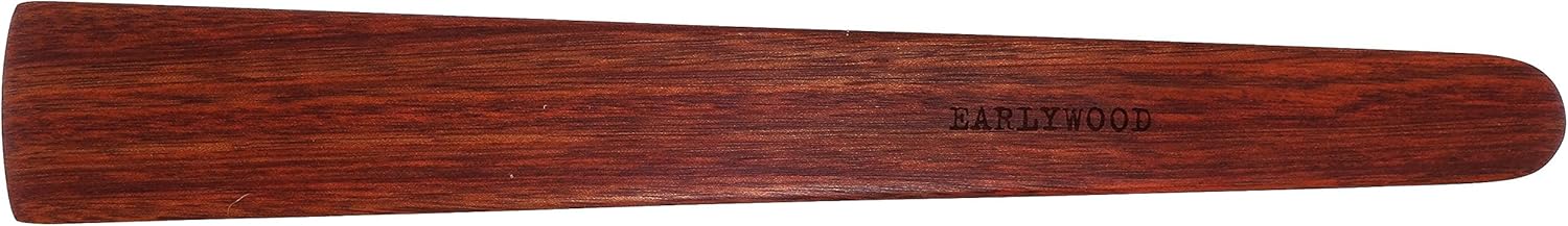 a wooden spatula with rounded edges