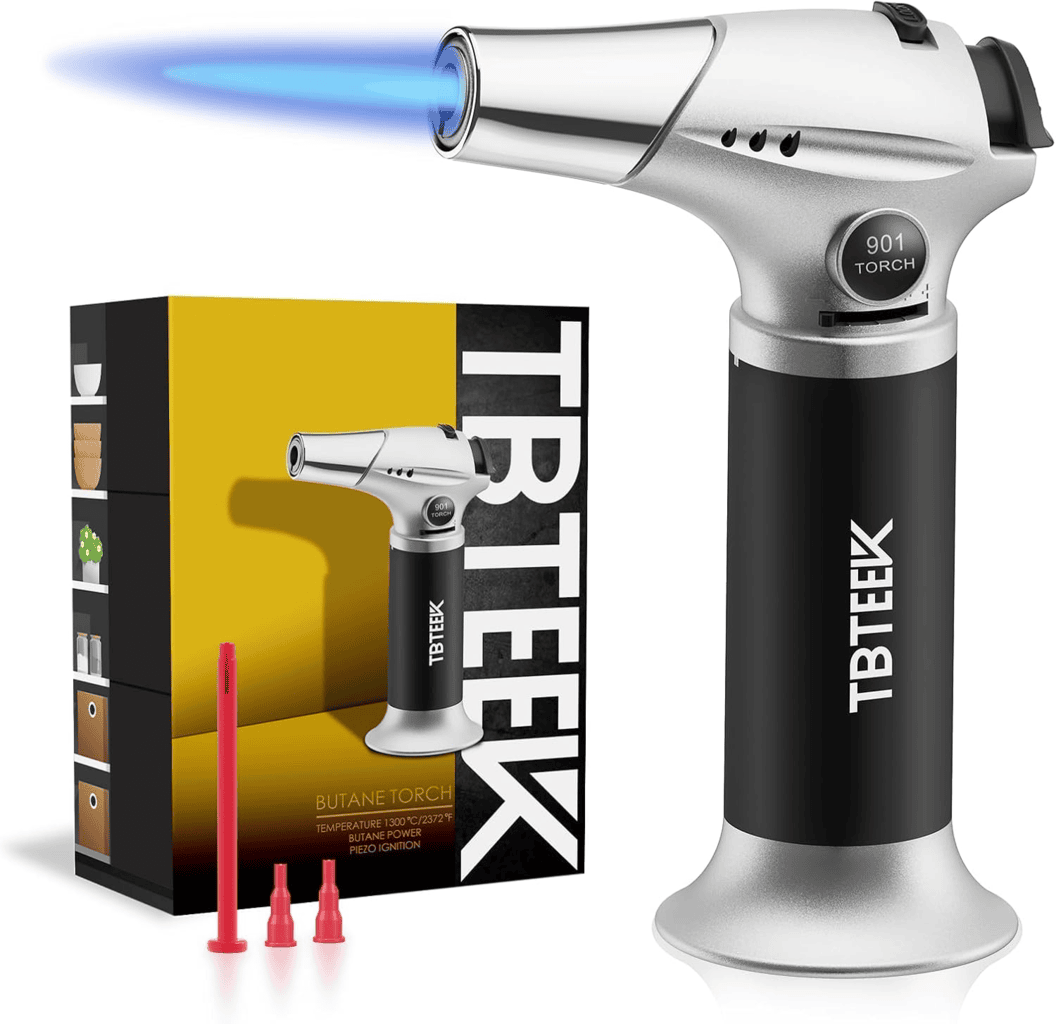 Refillable butane lighter with adjustable flame sitting next to it's box