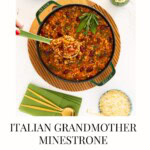 Italian Grandmother Minestrone soup in a green Staub Dutch oven with beans, vegetables, and acini de pepe pasta, styled overhead with Parmesan, green napkins, and serving spoon.