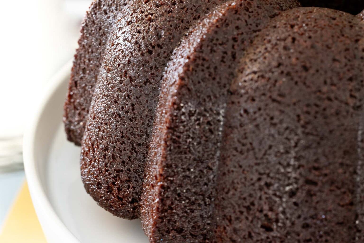 Close-up of moist chocolate pound cake crumb on a Bundt cake.