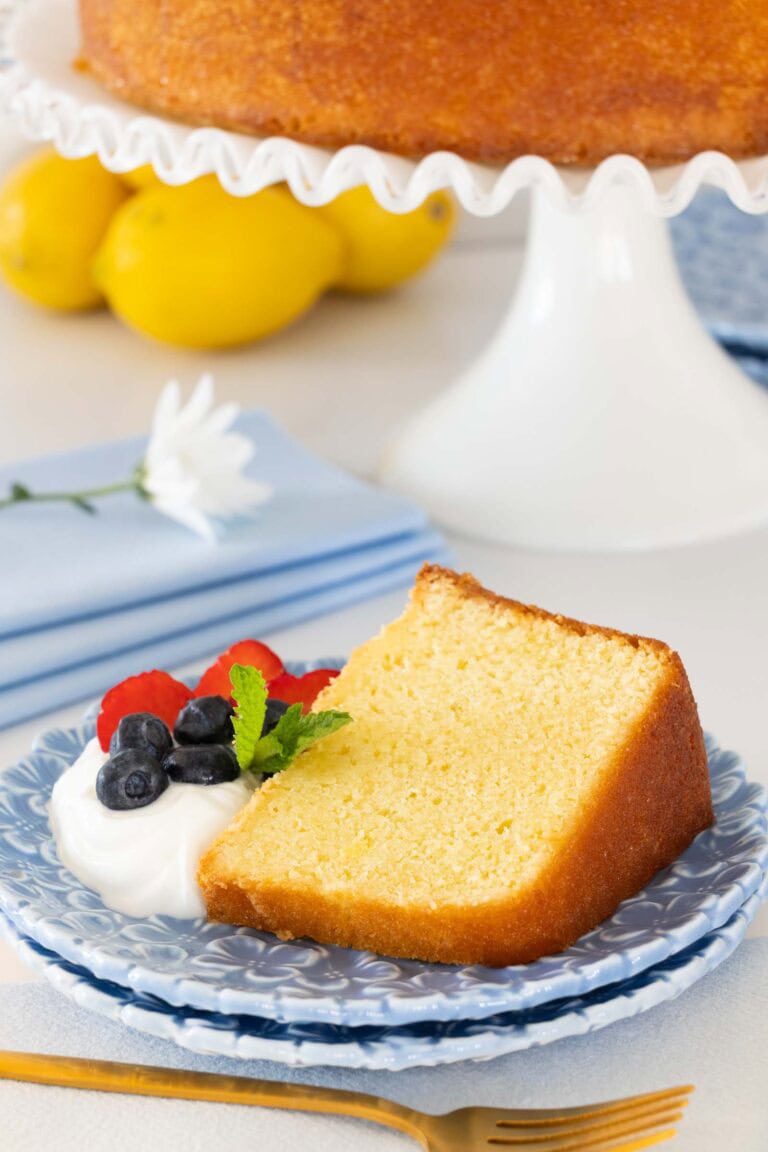 Slice of Lemon Olive Oil cake on a blue plate.