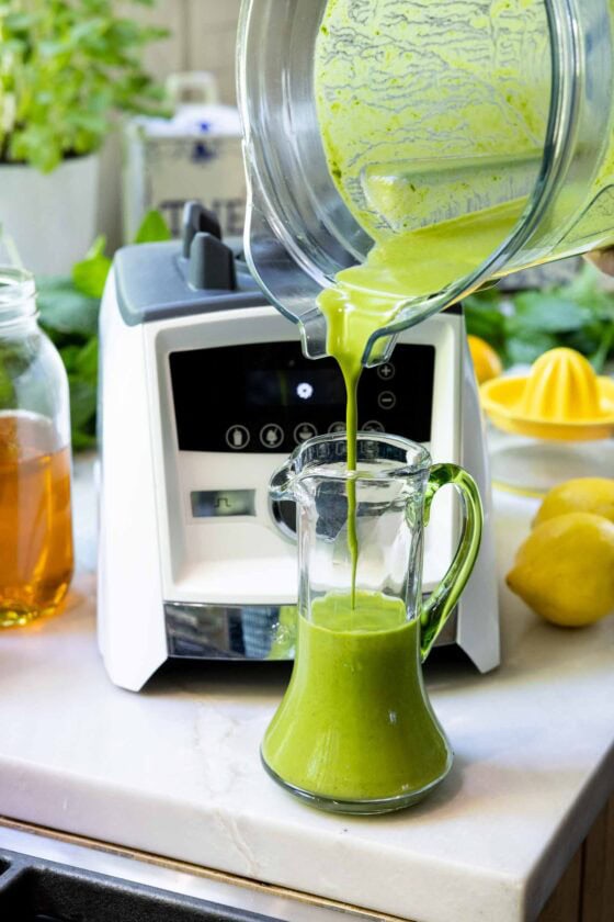 Bright green Honey Lemon Mint Salad Dressing being poured from a blender into a glass cruet beside lemons and honey on a kitchen counter.
Bright green Honey Lemon Mint Salad Dressing being poured from a blender into a glass cruet beside lemons and honey on a kitchen counter.
Bright green Honey Lemon Mint Salad Dressing being poured from a blender into a glass cruet beside lemons and honey on a kitchen counter.