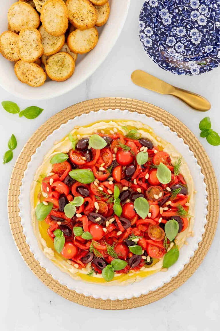 Italian White Bean Hummus on a platter with crostini. 