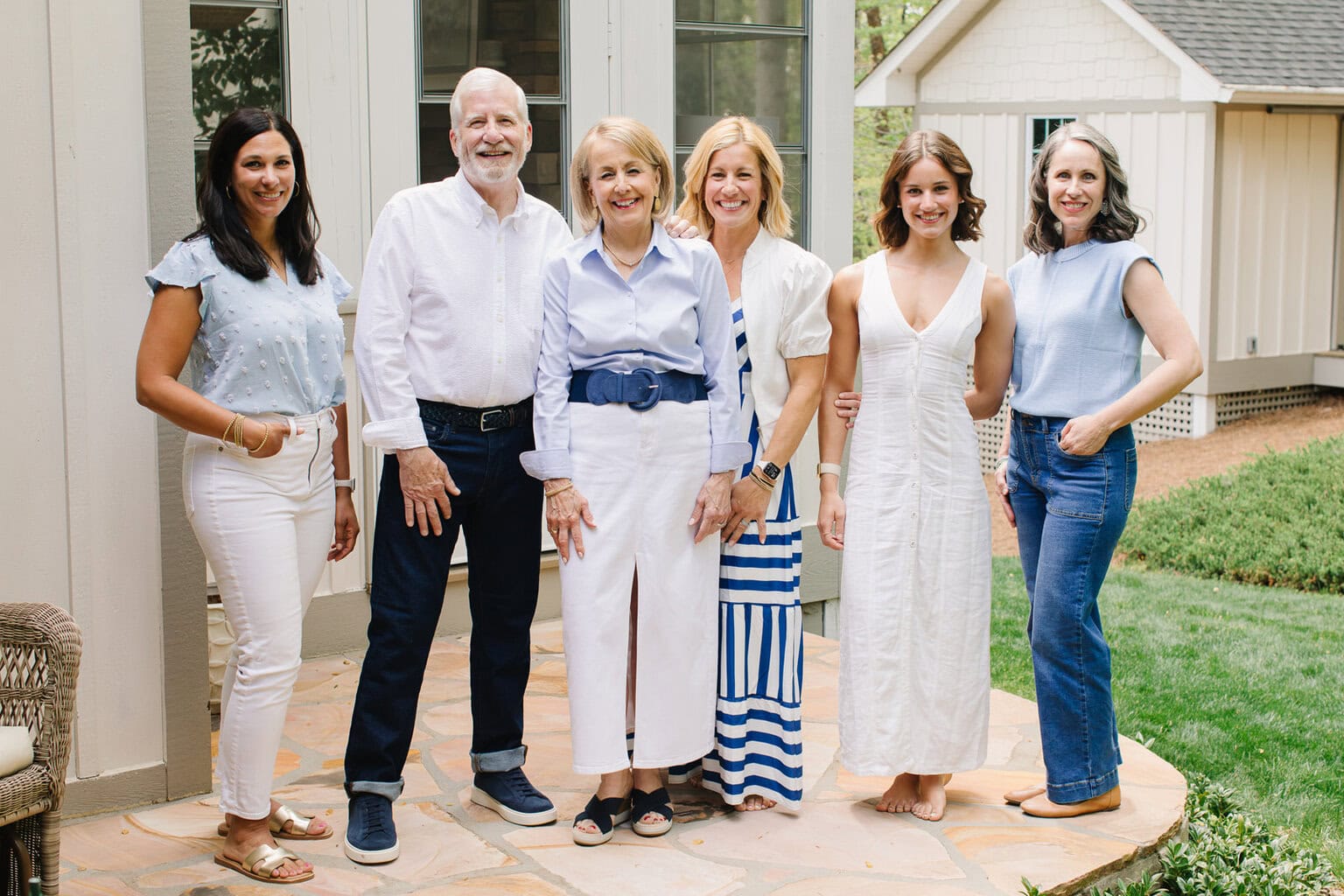 a photo of the Cafe team standing outside on a stone porch