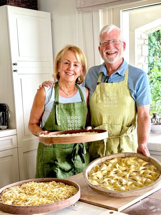 Chris and Scott proudly display handmade pasta after an authentic cooking class with Maria at Good Food Good Mood on Lake Garda, Italy.