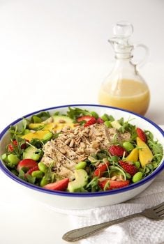 Arugula Chicken Salad with Honey Lime Dressing - a fabulous power salad full of lean protein and delicious fresh produce. The sweet-tart dressing is a perfect finishing touch!